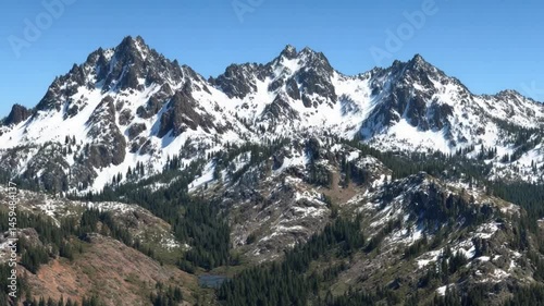 Wallpaper Mural Majestic Snow-Capped Mountains Surrounding Lush Green Valley Under Clear Blue Sky in Dramatic Landscape View Torontodigital.ca