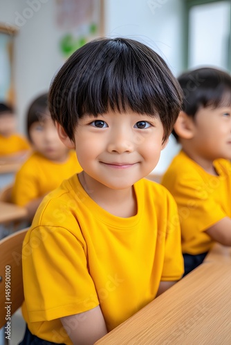 In a cheerful classroom, Asian schoolboys in yellow uniforms share ideas and build knowledge through teamwork and study.