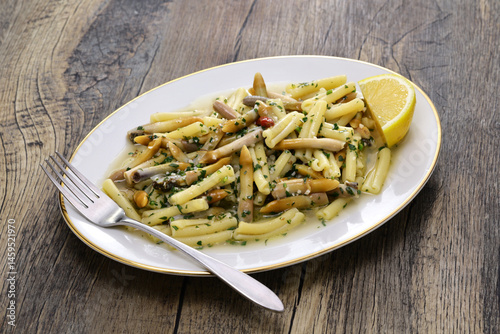 Caserecce pasta with razor clams photo
