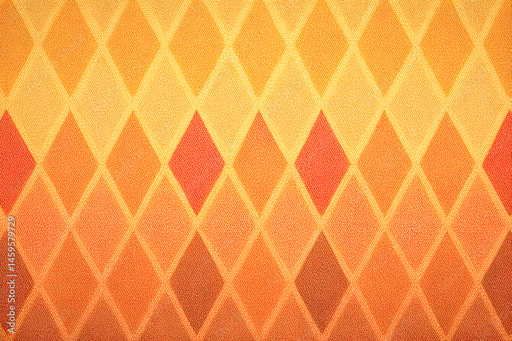 Fototapeta premium Orange Diamond Pattern: A vibrant, textured background featuring a repeating geometric pattern of orange diamonds in varying shades, creating a warm and visually appealing design. 