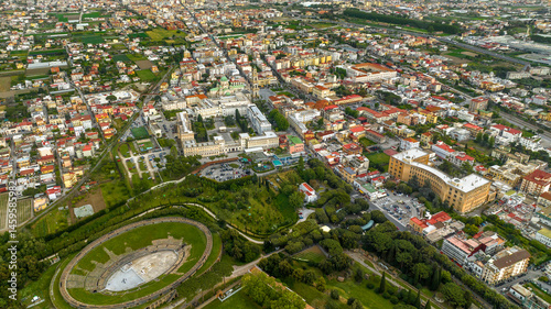 Obraz na płótnie Aerial view of the modern city od Pompei located in the province of Naples, Campania, Italy. In foreground there is the remains of the Pompeii amphitheater. w salonie