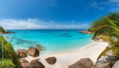 Wallpaper Mural panoramic view of a tropical beach with palm trees rocks and crystal clear turquoise water Torontodigital.ca