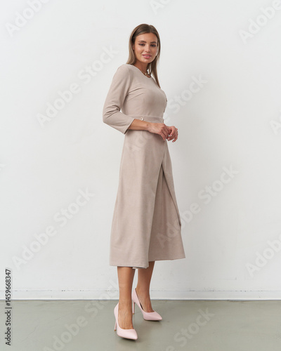 Elegant model showcases contemporary fashion in a studio setting