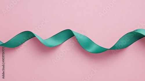 Obraz na płótnie Teal ribbon gracefully curving on a pink background w salonie
