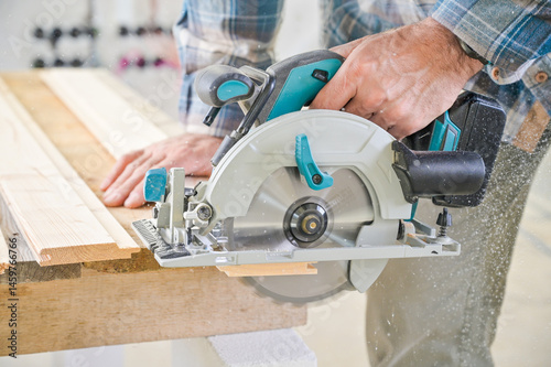 A skilled craftsman operates a circular saw on a wooden plank, showcasing precision and craftsmanship in a well-lit workshop environment, highlighting woodworking techniques