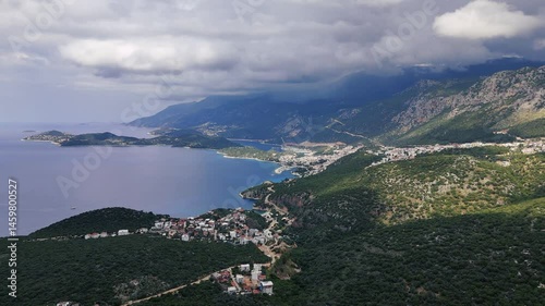 Stunning aerial view of Kas, a charming coastal town in Turkey, nestled between mountains and the Mediterranean Sea