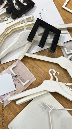 volumetric letters and hangers are scattered on the floor