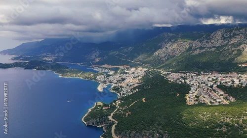 Stunning aerial view of Kas, a charming coastal town in Turkey, nestled between mountains and the Mediterranean Sea