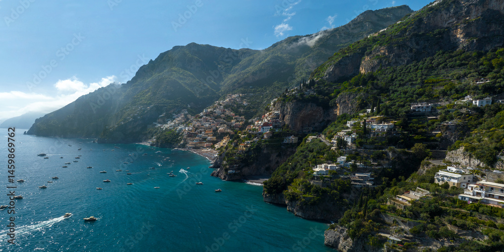 Panoramic aerial view of the Amalfi Coast, in the province of Salerno, Campania, Italy. In the center of the panorama there is the town of Positano, one of the most touristic and beutiful destinations