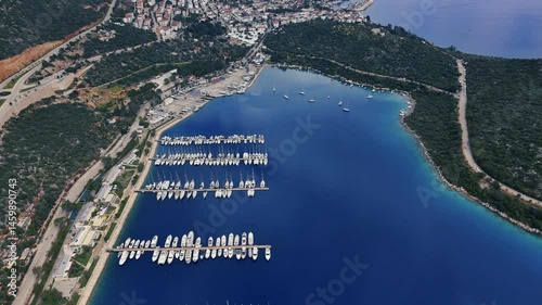 Stunning aerial view of Kas, a charming coastal town in Turkey, nestled between mountains and the Mediterranean Sea