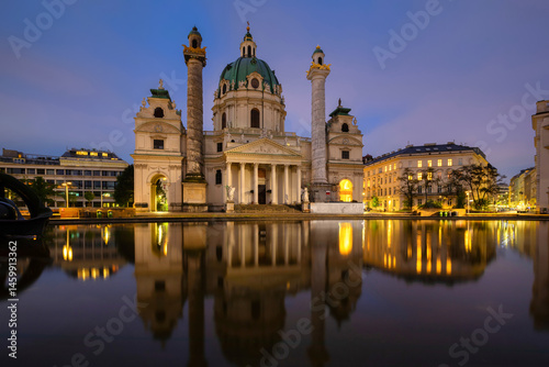 Vienna, Austria. View of St. Charles's Church (Karlskirche) reflecting in water at dusk