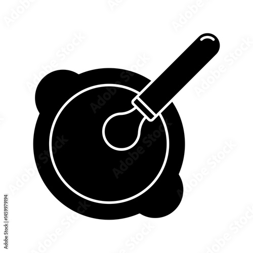 Plate with spoon. Feeds baby.