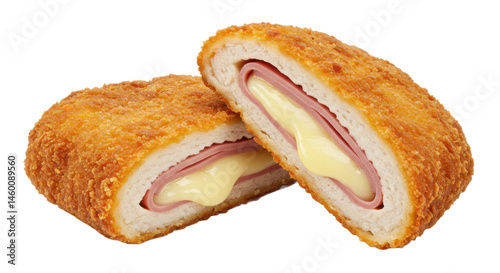 Close up shot of two pieces of cordon bleu showing the ham cheese and breading on a neutral background