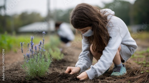 Obraz na płótnie Students participating in a school garden project that creates an inviting ecosystem for local pollinators emphasizing education in wildlife protection. w salonie