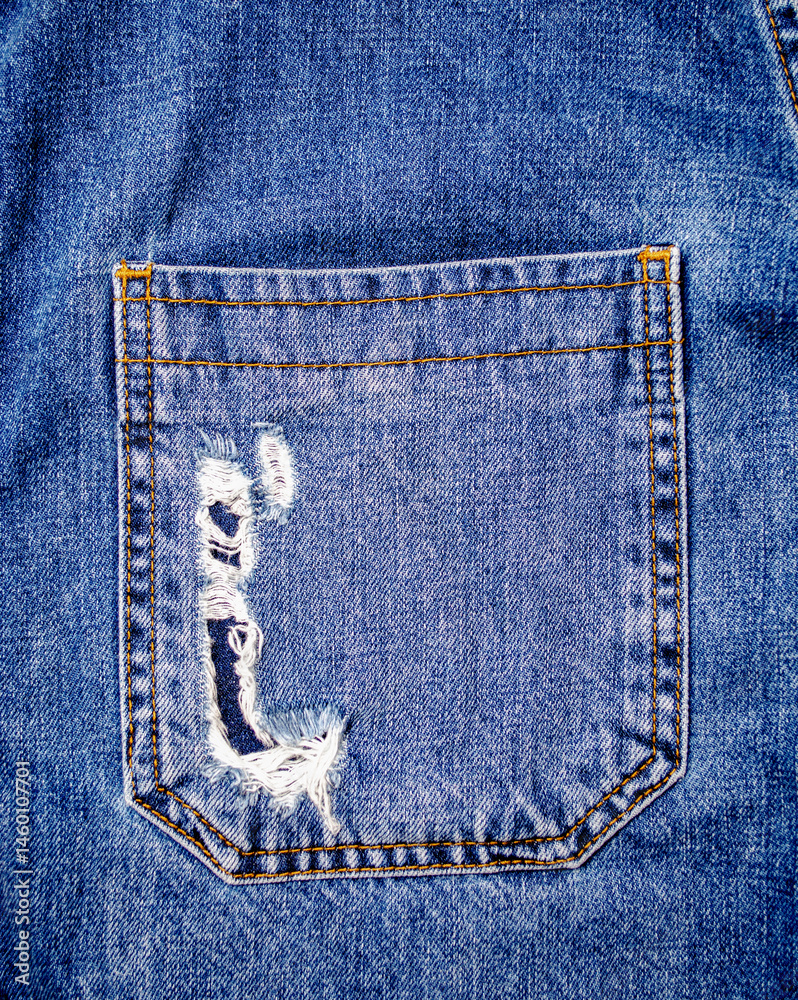 Worn Torn Back Pocket of Blue Denim Jeans for Fashion Design and Textile Texture Reference
