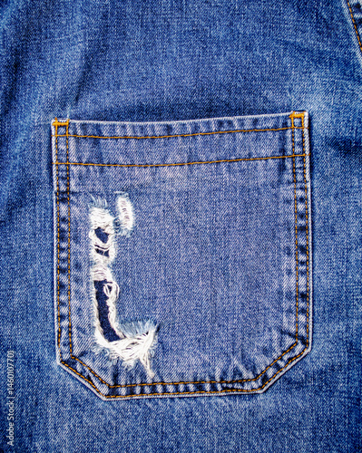 Obraz na płótnie Worn Torn Back Pocket of Blue Denim Jeans for Fashion Design and Textile Texture Reference w salonie