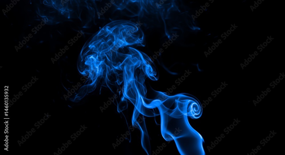 Fototapeta premium Blue smoke swirls elegantly against a stark black background creating drama