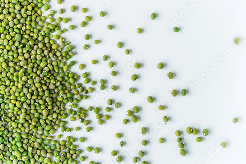 A clean arrangement of fresh, whole green beans displayed on a white background, showcasing their vibrant color and natural texture photo