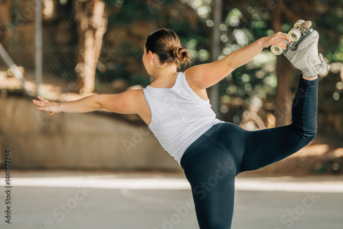 young woman training or doing sports outdoors, skater