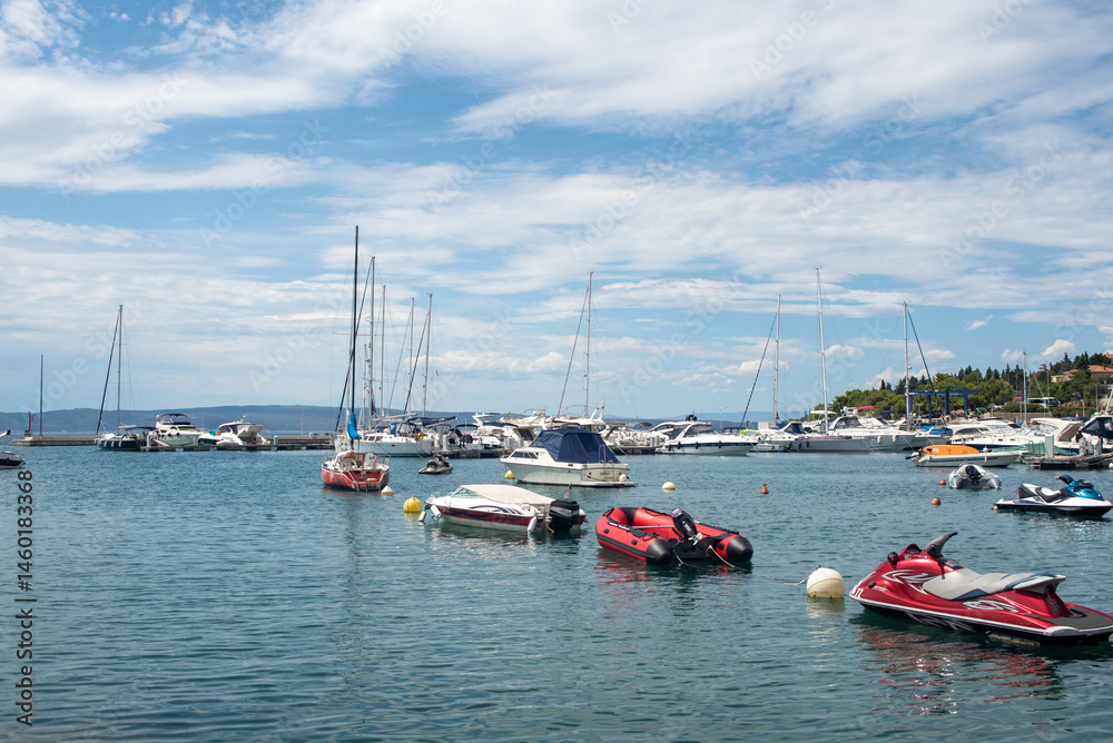 boats and yachts anchored in marina harbor
boats and yachts anchored in marina harbor