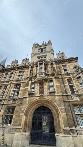 
Atmospheric Old Gothic Building with Archway and Gates in England
