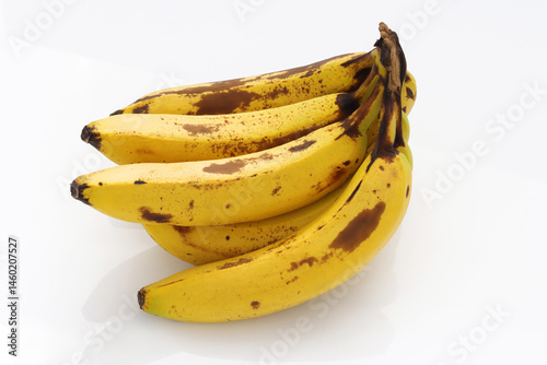 Over ripened Fresh bunch of bananas on white background
