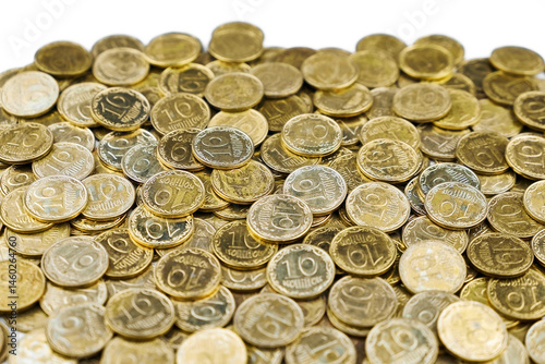 Pile of Ukrainian 10 kopiyok coins, symbolizing economy, finance, and savings.