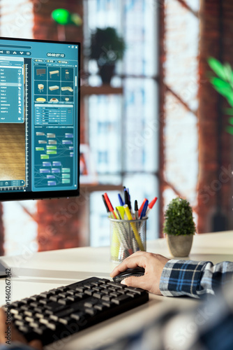 Obraz na płótnie Interior designer uses architectural software to generate virtual photorealistic image renderings. Man preparing visual preview for customers after designing room with 3D modeling application w salonie