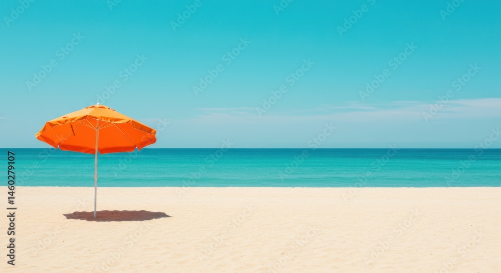 Orange umbrella on a white sand beach with a turquoise ocean and a clear blue sky in the background Orange umbrella on a white sand beach with a turquoise ocean and a clear blue sky in the background