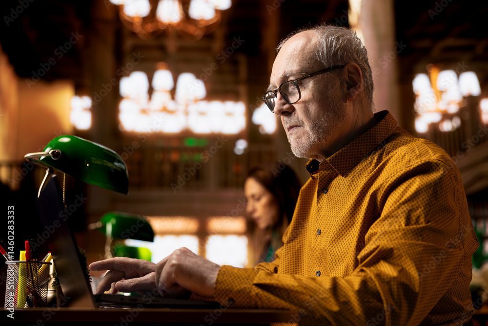 Elderly adult reading complex research documents under a green lamp, showcasing the power of wisdom and focus in senior learning environments. Academic studying in a public library.