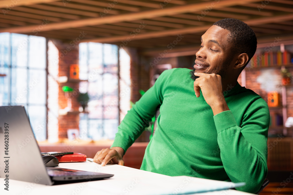 Freelancer in home office sitting at desk and typing on laptop keyboard. Remote employee using electronic device to do customers relations job online, answering inquiries