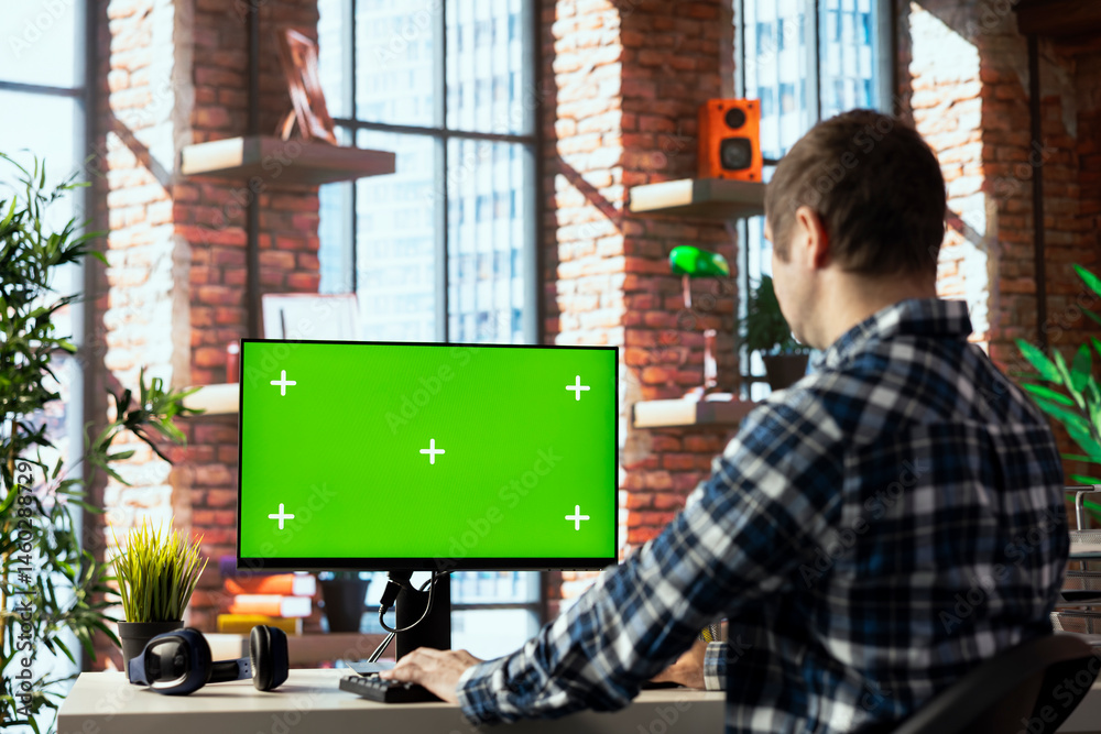 Freelancer in home office completing spreadsheets on mockup computer, entering data, calculating totals. Remotely working accountant analyzing figures on green screen PC, using spreadsheet software
