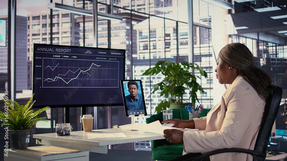 Black business entrepreneur pitching a new project idea to a shareholder via videocall, discussing about investing more funds for global expansion. Female CEO with determination for growth. Camera B.