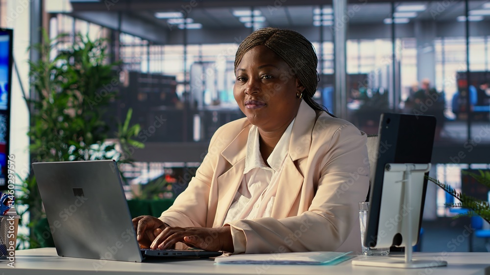 Powerful female entrepreneur focuses on strategic planning, setting a clear vision and goals for the corporation and aligning resources to achieve sustainable growth. Determination. Camera A.