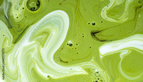 Green tea matcha mixing with milk texture background Food and drink close up