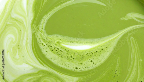 Green tea matcha mixing with milk texture background Food and drink close up