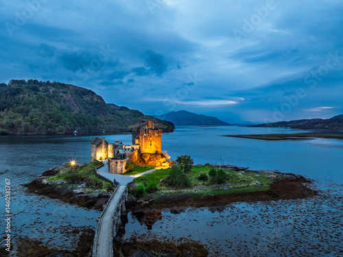 Night over Eilean Donan Castle and Loch Duich from a drone, Isle of Skye, Highlands, Scotland, England
