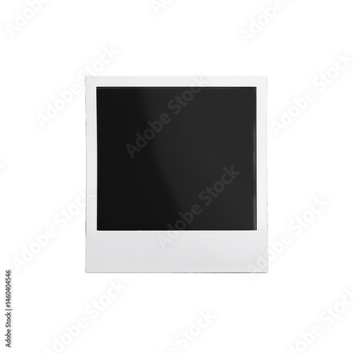 Close-up of a classic white Polaroid instant photo against a neutral surface