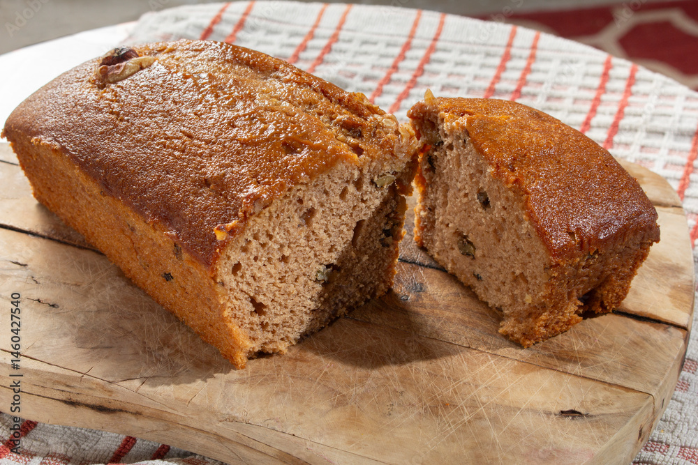 A view of a sliced vegan banana bread. A view of a sliced vegan banana bread.