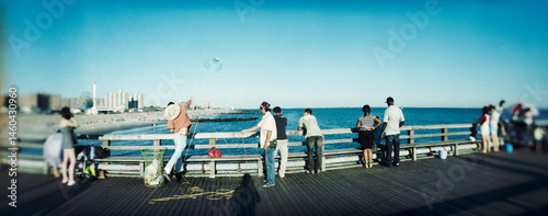 Panoramic view of tourists on the pier at Coney Island, Brooklyn, New York City, New York State, USA.