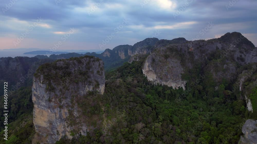 Rai Leh beach towering limestone cliffs emerging from tropical forest in Krabi, Thailand. Best aerial view flight drone shot footage from above Rai Leh beach towering limestone cliffs emerging from tropical forest in Krabi, Thailand. Best aerial view flight drone shot footage from above