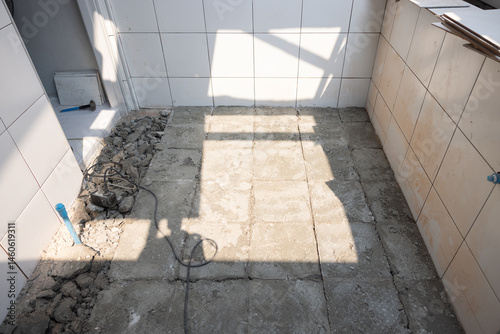 Demolish remove tile and concrete floor inside toilet bathroom for new re-construction or installation tile floor again cause of quality control or qc check. To break concrete for remove outside.