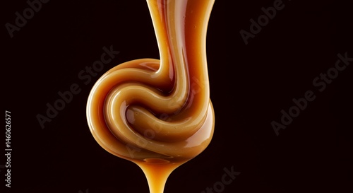 Swirling Beige and Umber Caramel Cascading with Viscous Ribbon Texture in a Macro Studio Shot Against Dark Chocolate Backdrop