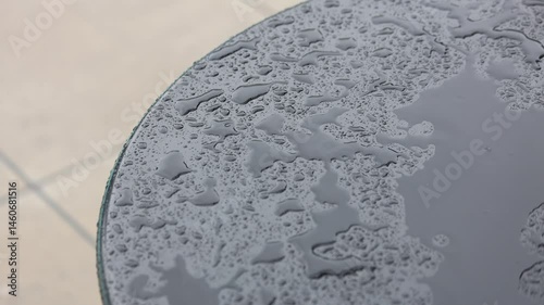 Rain Slashing On Black Table