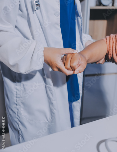 Orthopedist examining patient in hospital
