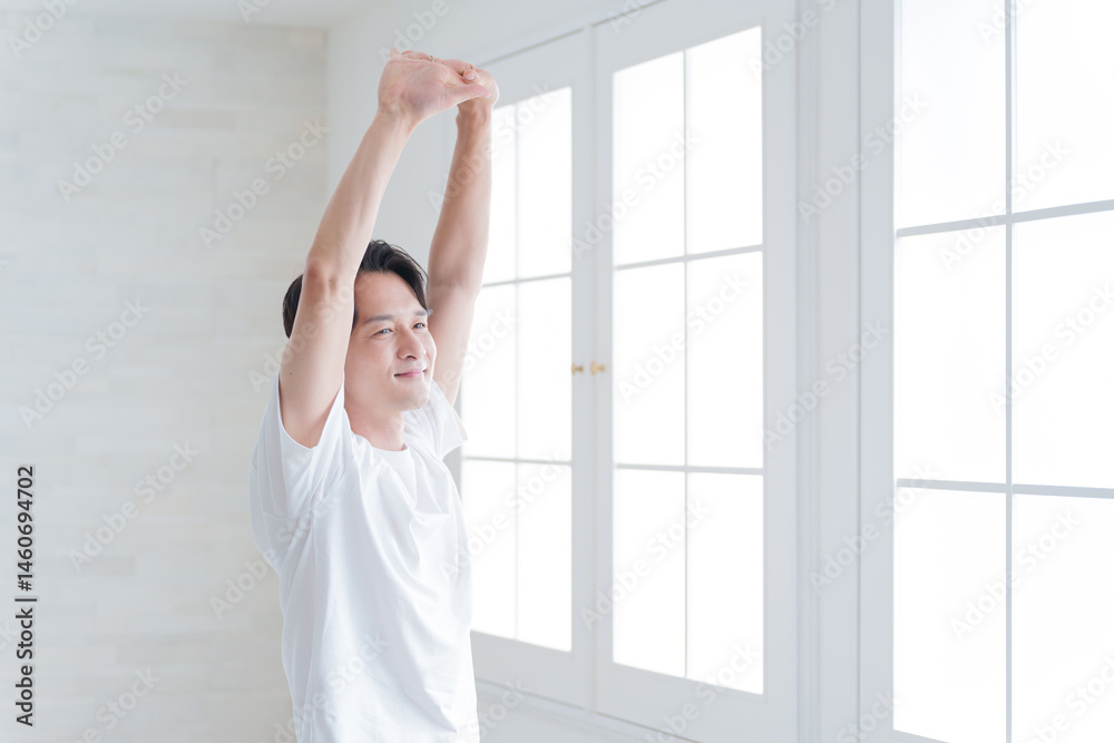 Fototapeta premium ストレッチするミドル男性