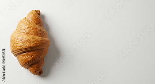 The golden croissant on pure white background with copy space 