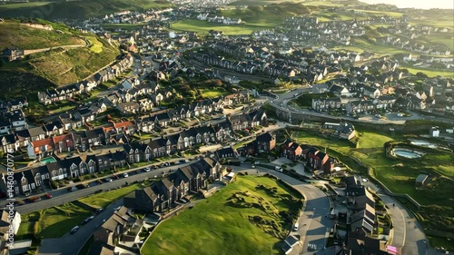 Aerial view of Holyhead island showing townscape and coastal landscape at sunset, Holyhead island aerial view across townscape homes and scenic sunlit townhouse mountain property