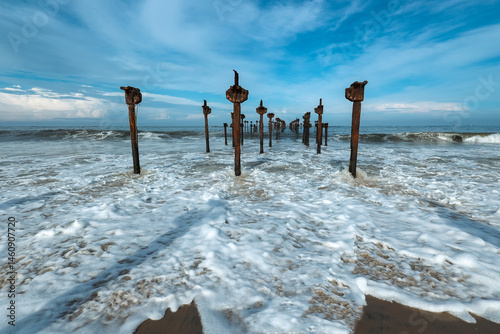 Old pier ruins extends to the sea beach view from the Venice of the East Alappuzha beach Kerala India. Famous destination of backwaters in Kerala top tourist places in Kerala.	
