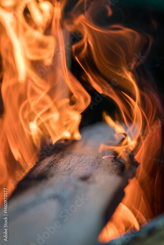 Timber plank on fire with shallow depth of field photo